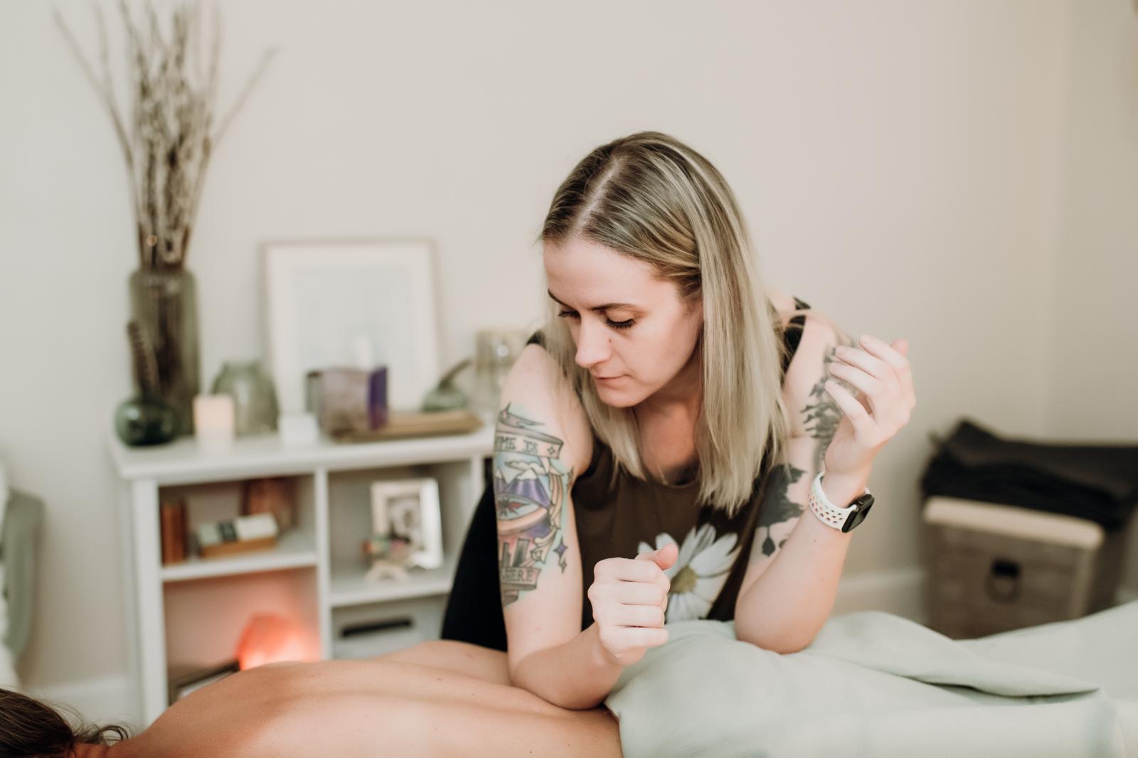 A therapist working with a client in the treatment room